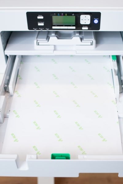 Sawgrass SG1000 printer with open paper tray with 11 x 17 paper.