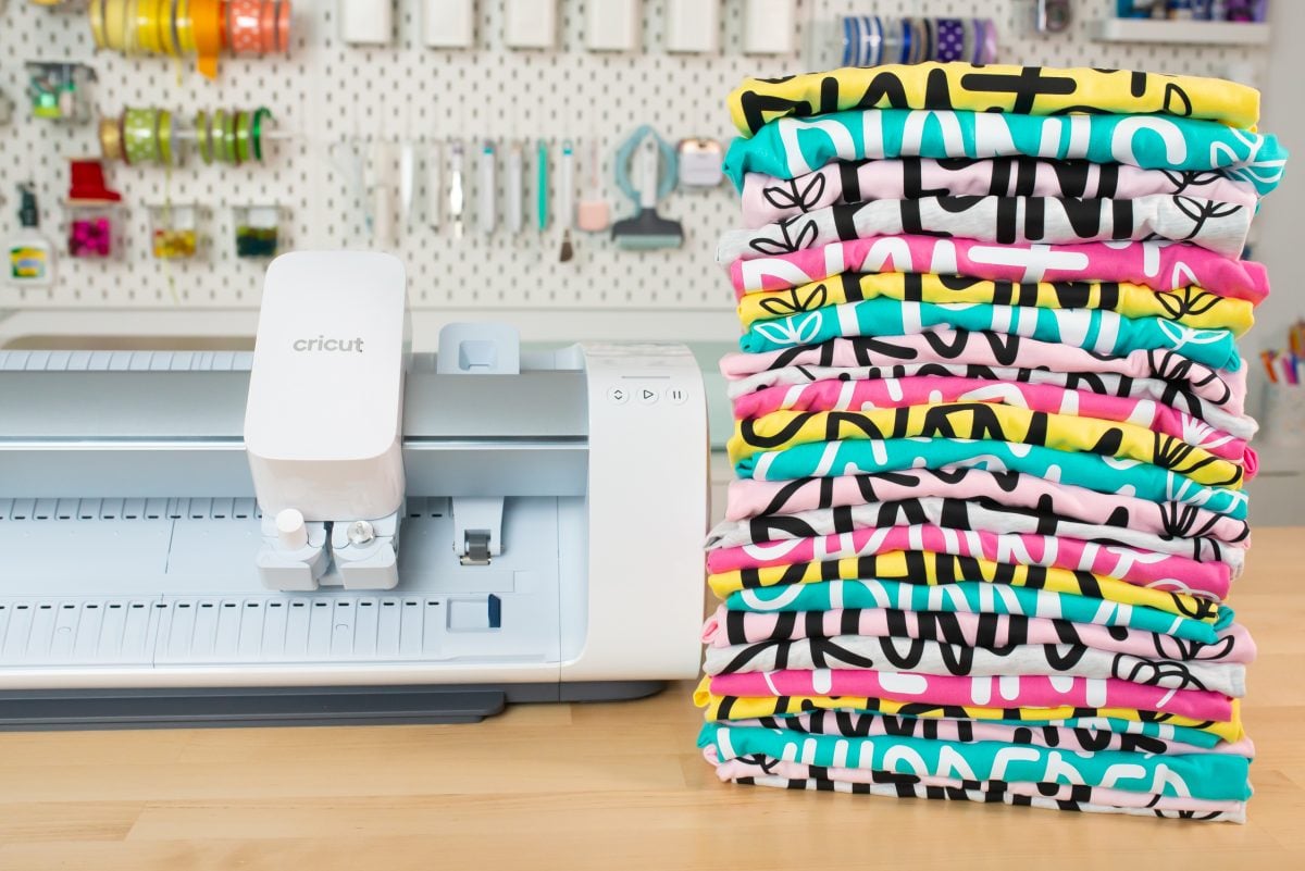 Batching crafts: stack of colorful shirts made with Cricut Venture