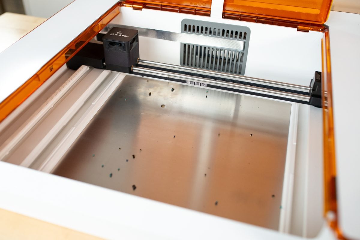 Glowforge Aura with crumb tray removed showing crumbs