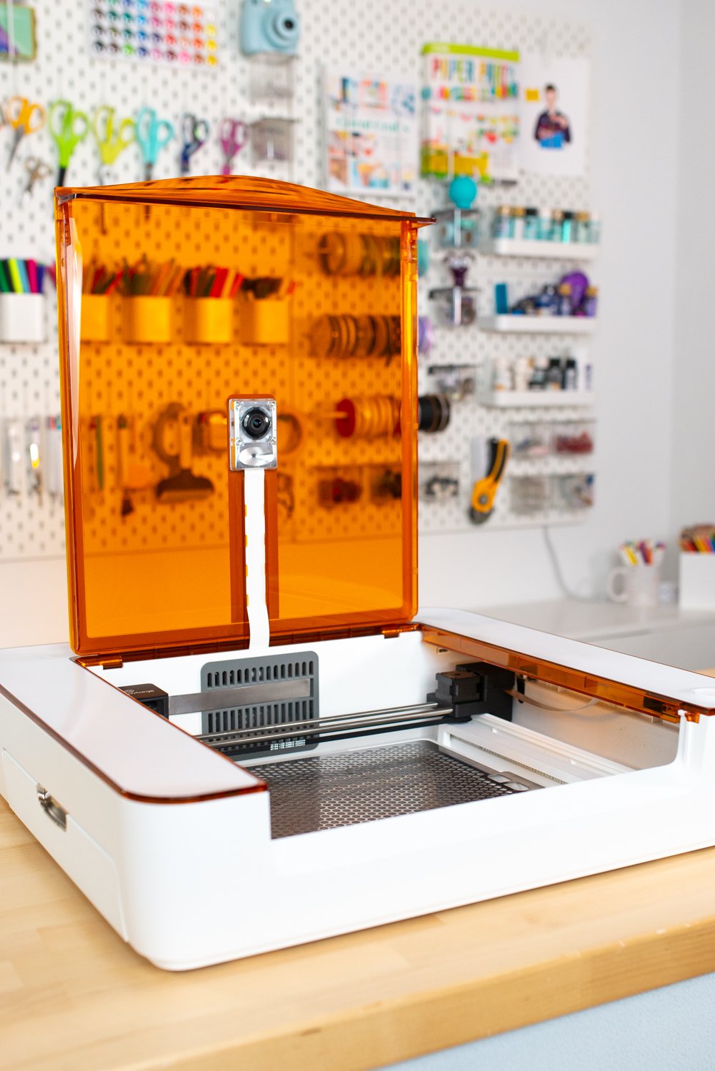 Glowforge Aura on desk with lid open.