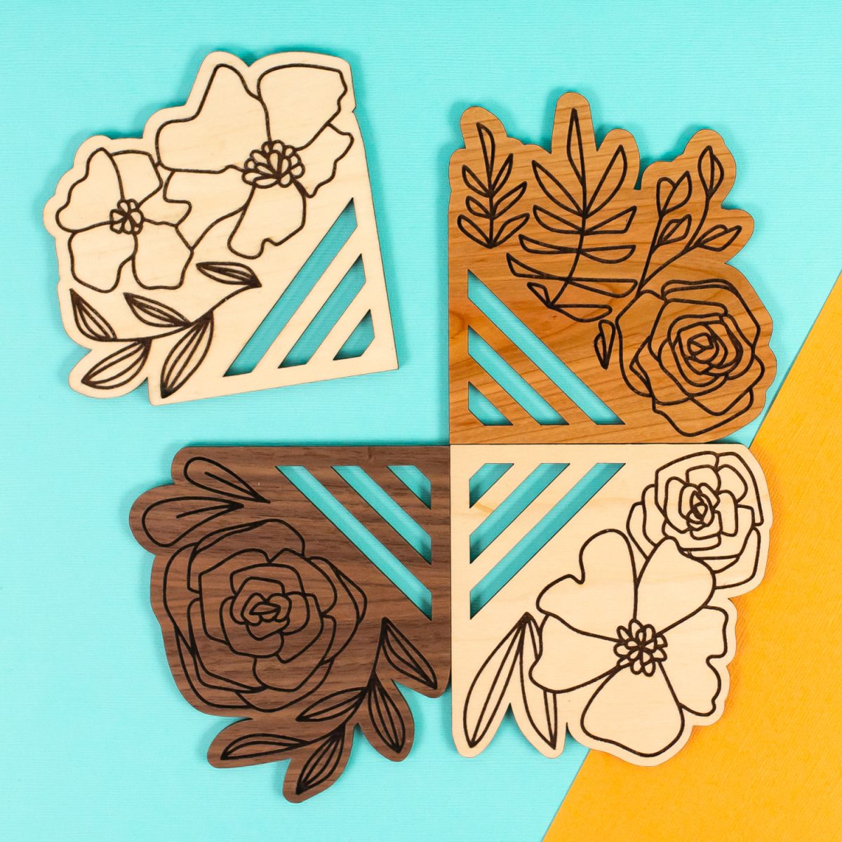 Laser cut coasters on orange and teal background