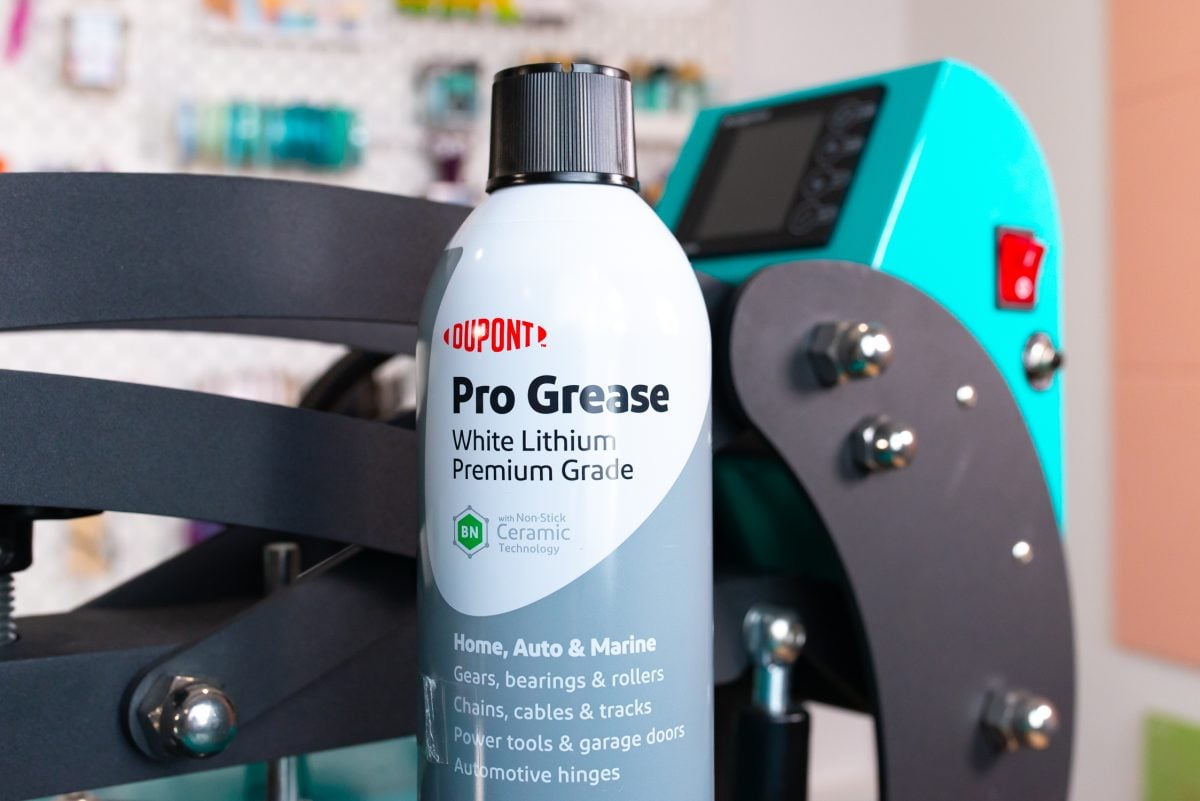 Pro Grease next to a heat press.