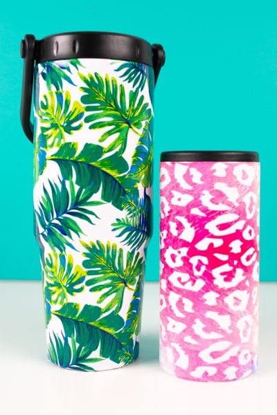 Final leaf and leopard sublimation tumblers on teal background