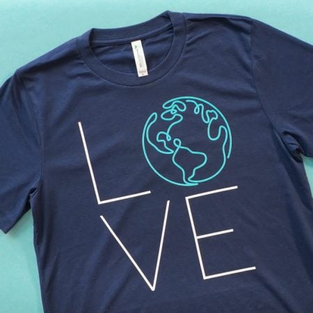 Final Earth LOVE shirt on teal background