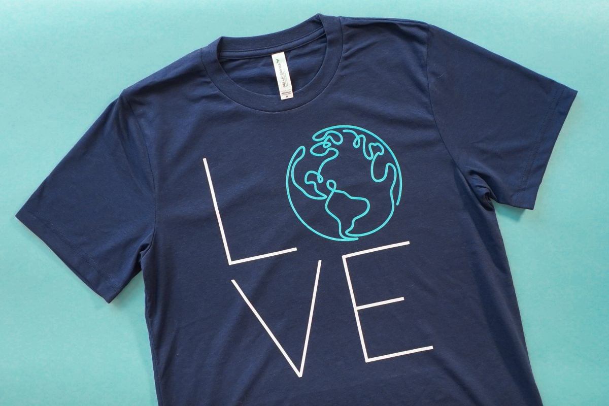 Final Earth LOVE shirt on teal background