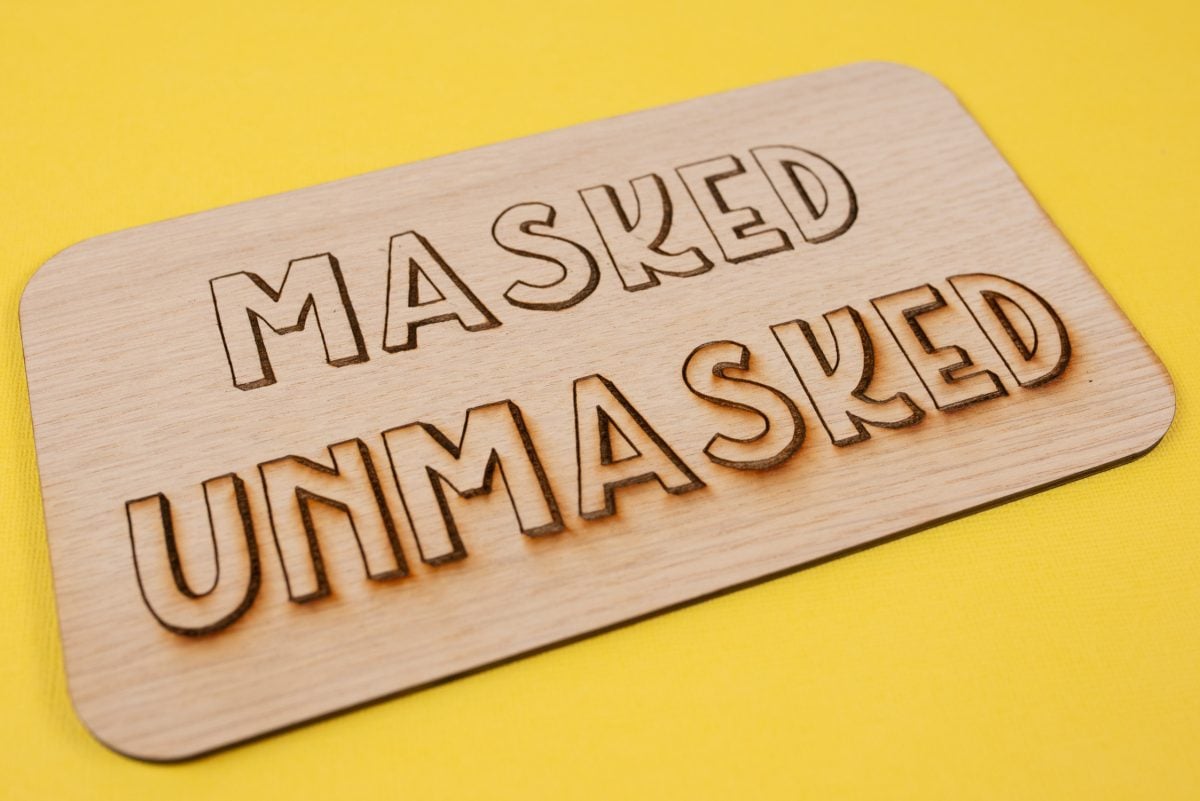 Project showing the word "unmasked" with charring and the word "masked" with no charring