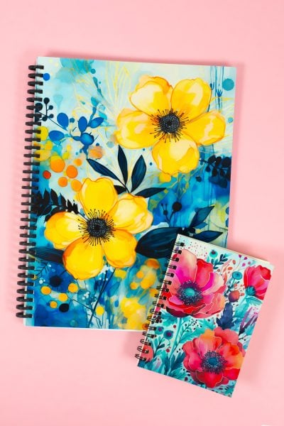 Two sublimation journals on a pink background