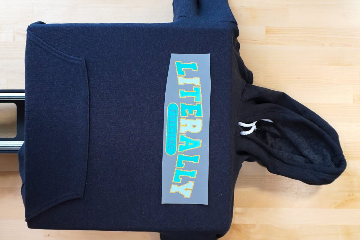 Hoodie on heat press with DTF transfer