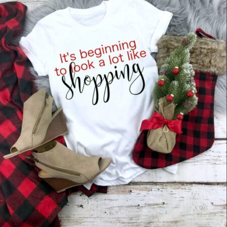 White t-shirt that says It's beginning to look a lot like shopping