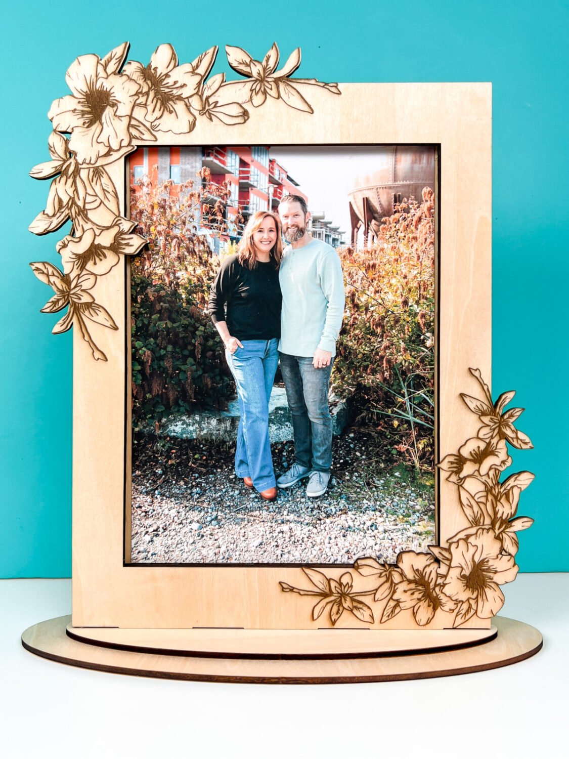 Engraved flower frame with picture of Cori and Ryan