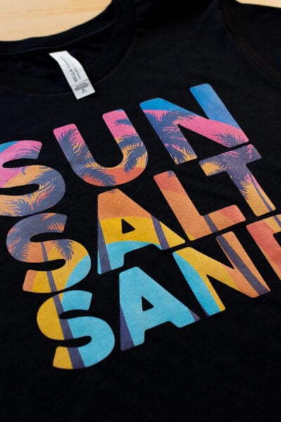 Black shirt with SUN SALT SAND image on it