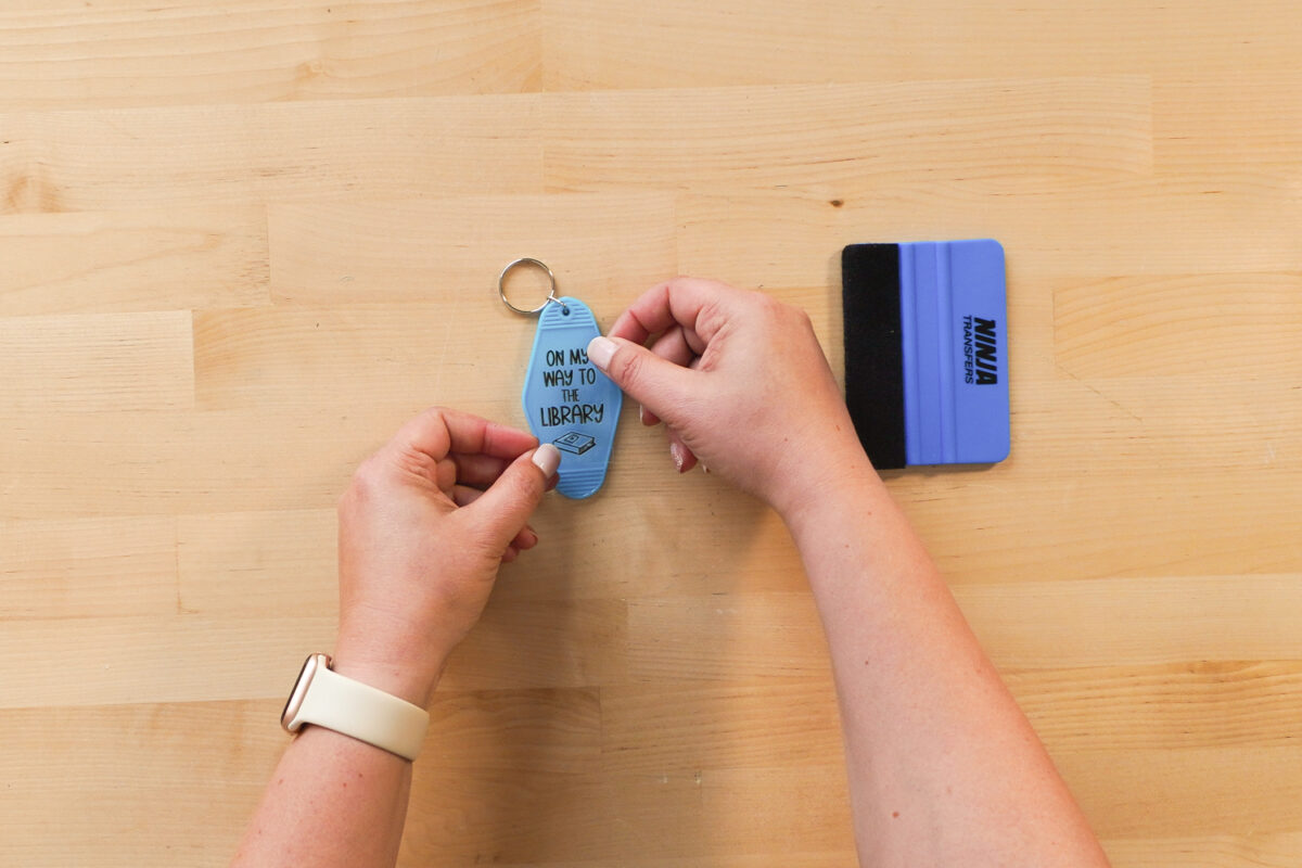 Placing the transfer on the keychain