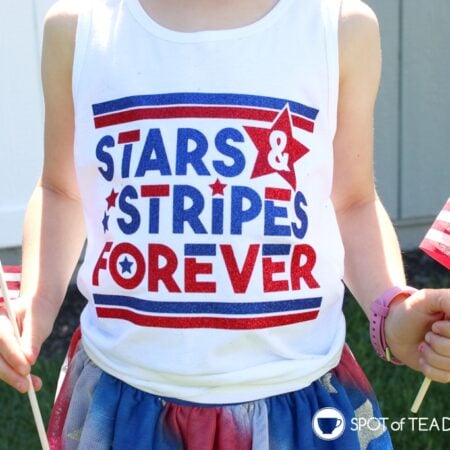 Girl wearing a white tank top with a patriotic theme