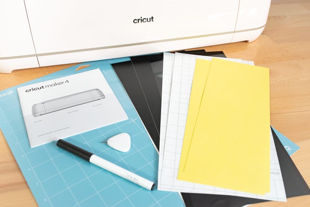 Cricut Maker 4 with materials and tools and mat