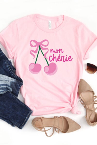 Mon Cherie cherry SVG on a pink shirt with girlie accessories