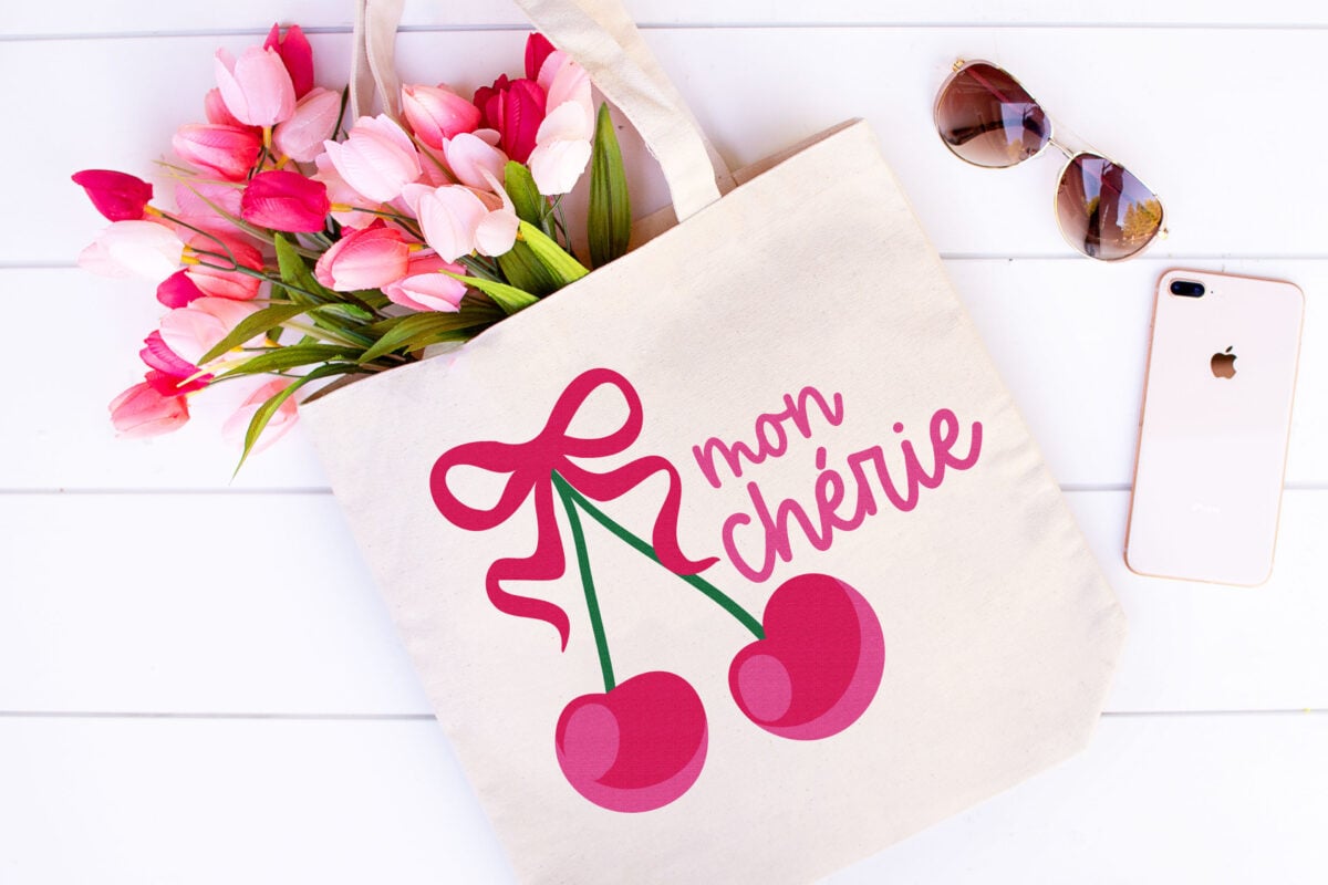 Mon Cherie cherry SVG on a tote bag that is holding tulips