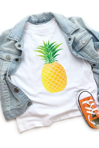 White kids shirt with pineapple image on it