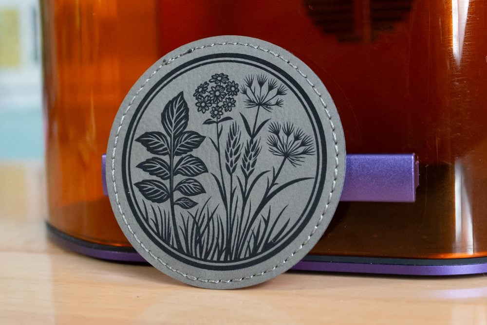 Engraved gray leather patch with wildflower design