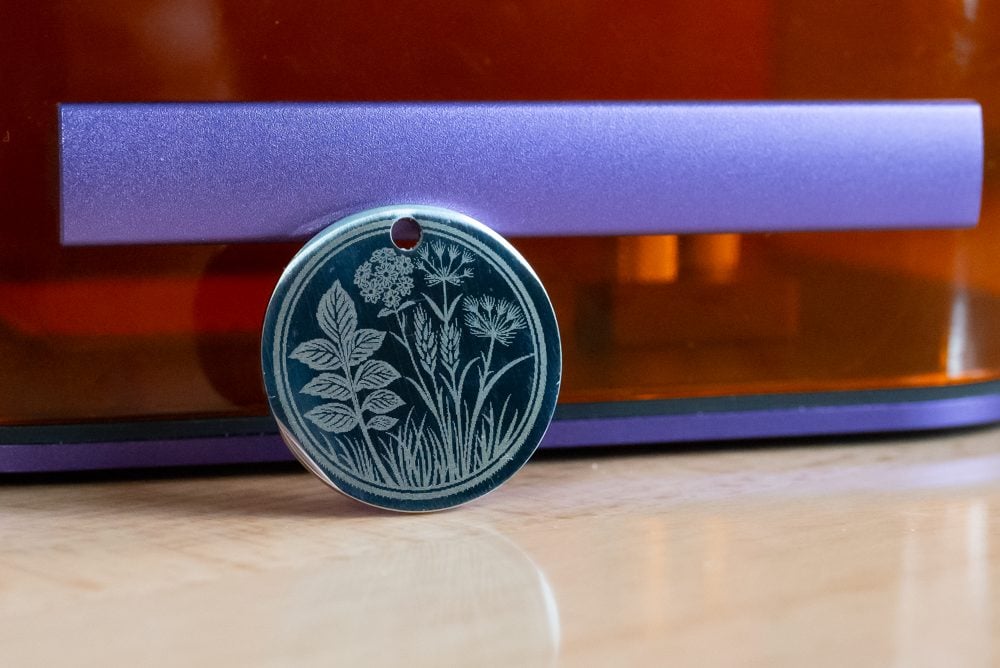 Engraved metal necklace blank with wildflower design