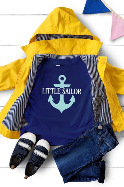 Little Sailor SVG on a dark blue shirt with a yellow rain coat