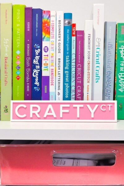 Crafty Ct street sign on a bookshelf with crafty books