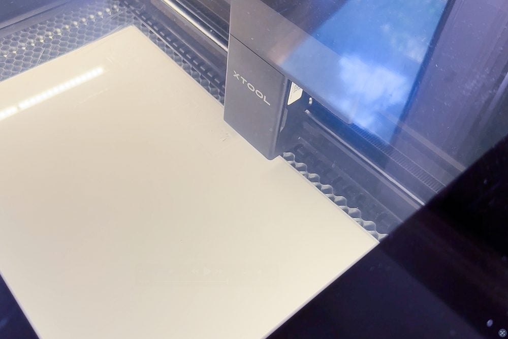 Laser with white acrylic cut
