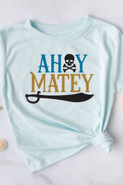 Ahoy Matey free pirate SVG on a blue t-shirt with shells