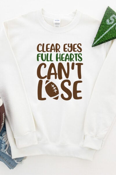 Clear Eyes, Full Hearts, Can't Lose SVG on a t-shirt with a football