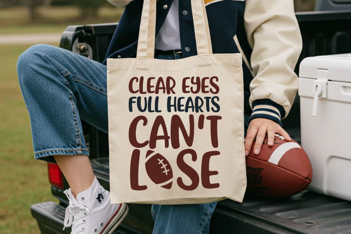 Clear Eyes, Full Hearts, Can't Lose SVG on a tote bag with a football
