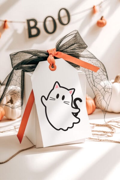 Cat ghost SVG on a tag for a halloween gift box
