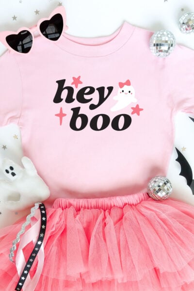 Hey boo ghost SVG on a pink shirt with halloween decor
