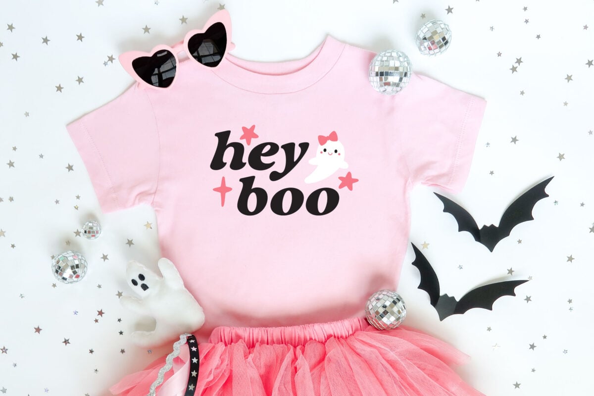 Hey boo ghost SVG on a pink shirt with halloween decor