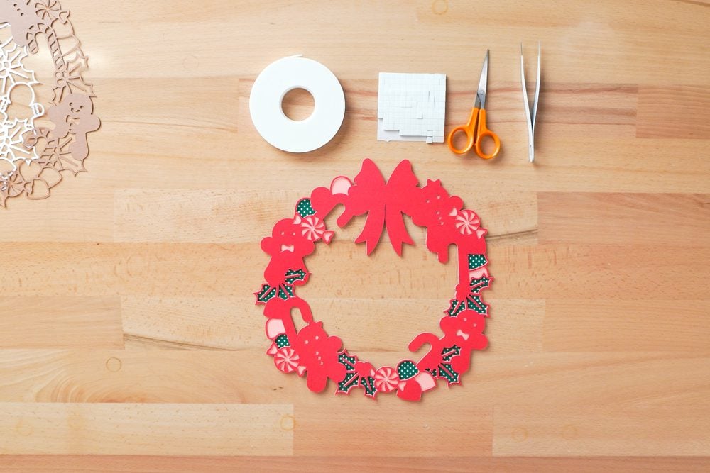 Three layers adhered - green, pink, then red.