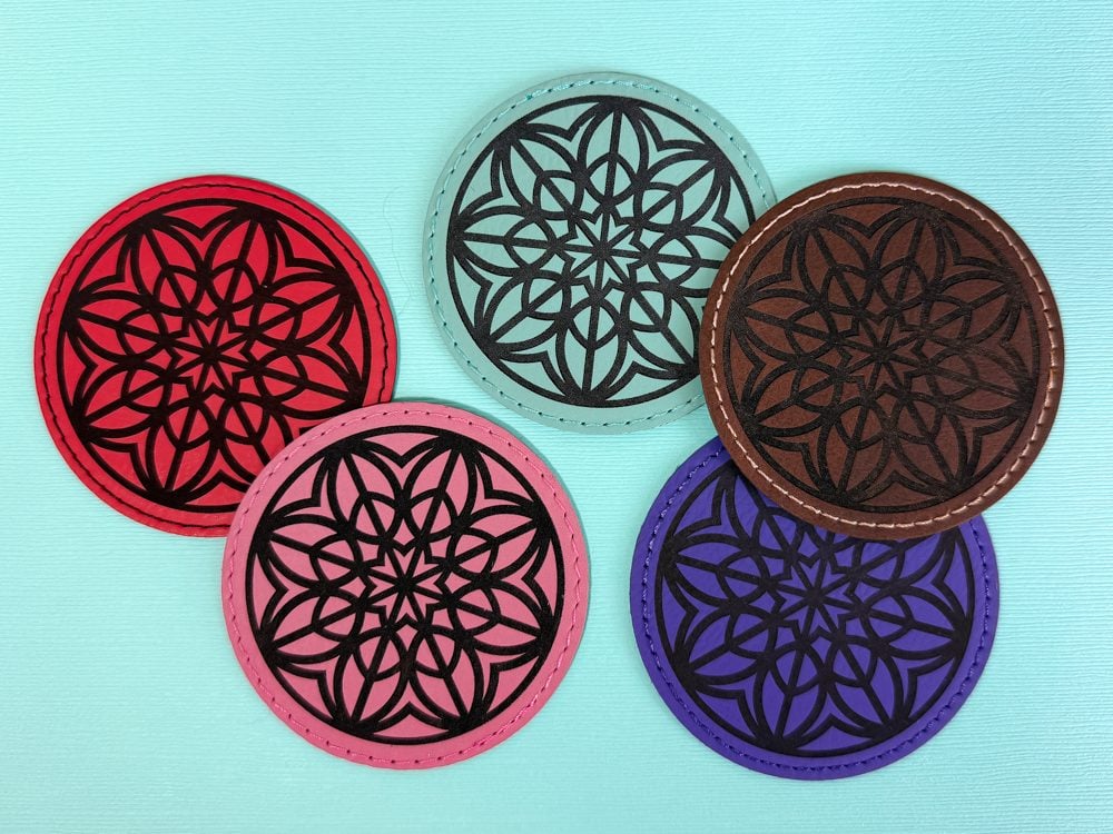 Engraved leather patches on a blue background