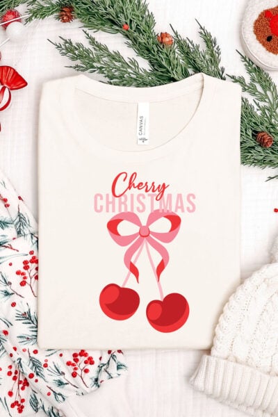 Cherry Christmas sublimation file on a shirt with Christmas accessories
