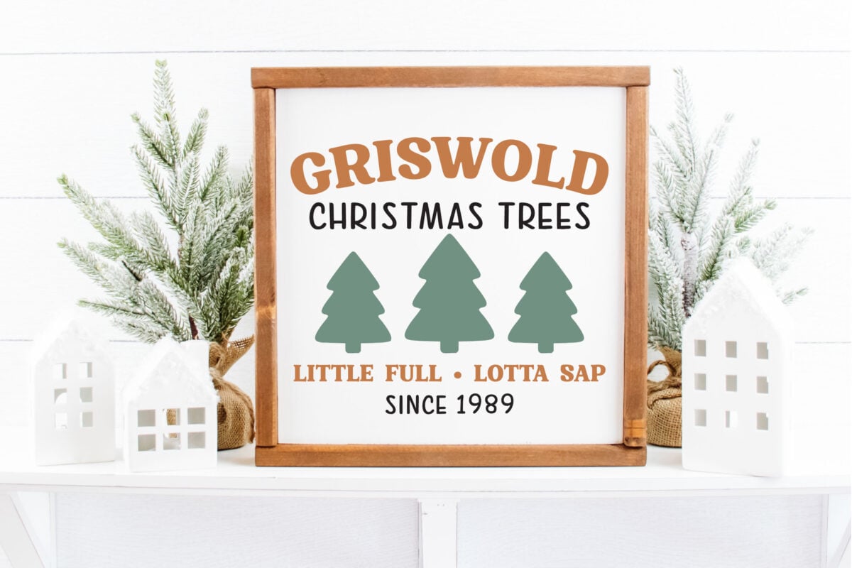 Griswold Christmas Trees SVG on a sign with Christmas accessories