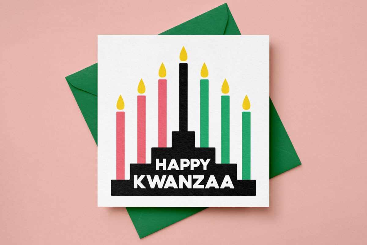 Happy Kwanzaa SVG on a card with a green envelope