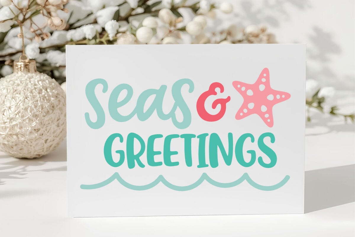 Seas & Greetings Christmas Beach SVG on a card with Christmas decorations