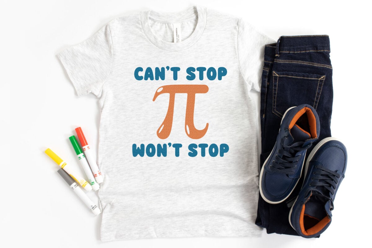 Free pi day svg on a kids shirt with school supplies