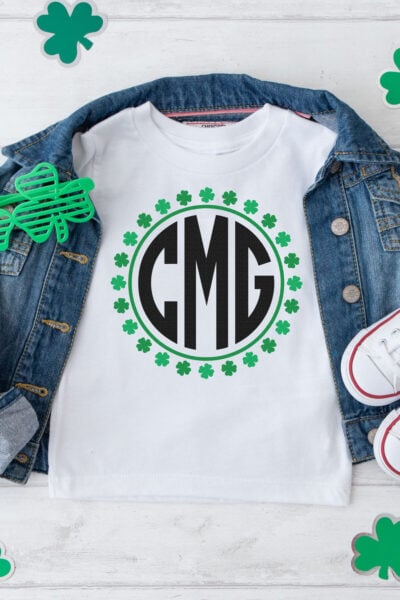 St. Patrick's Day Monogram used on a white shirt with a jean jacket and paper shamrocks