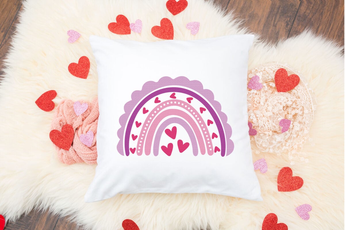 Valentine's Day Rainbow SVG on a white pillow