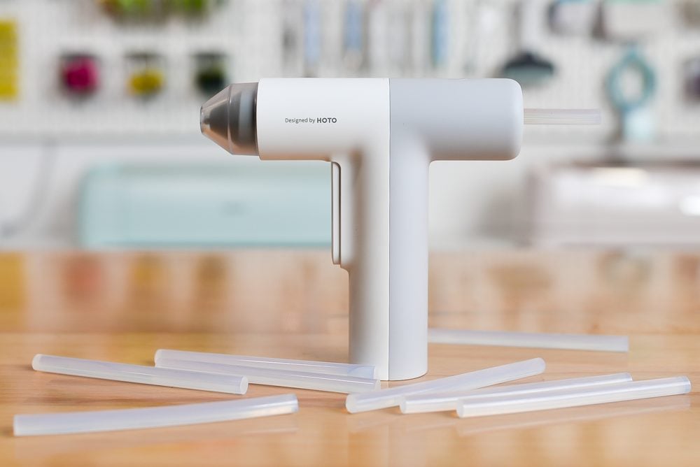 HOTO Hot Glue Gun on a table with glue sticks