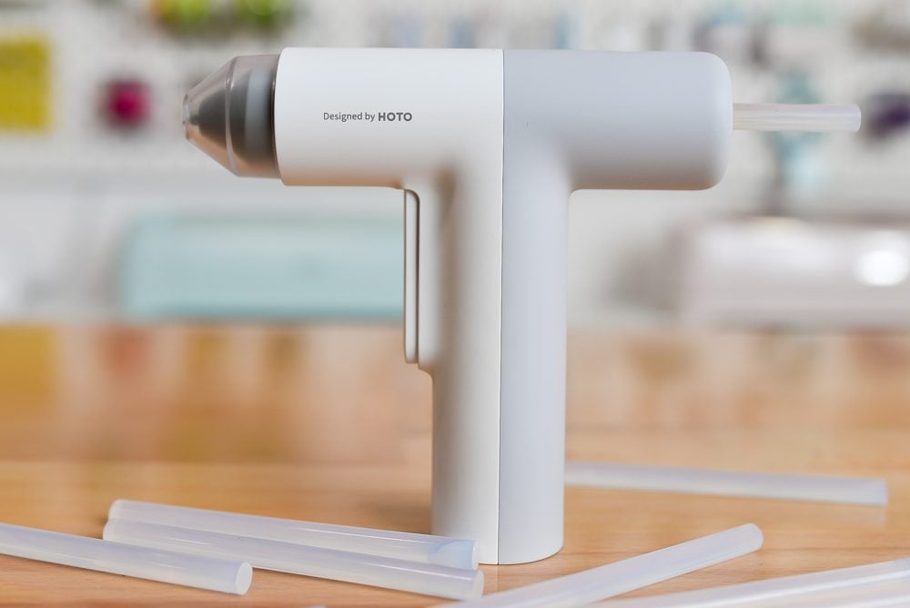 HOTO Hot Glue Gun on a table with glue sticks
