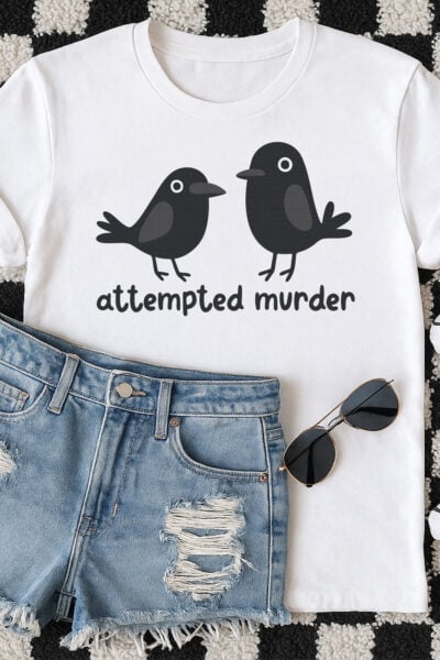 Crow SVG om a white tee on a checkered rug