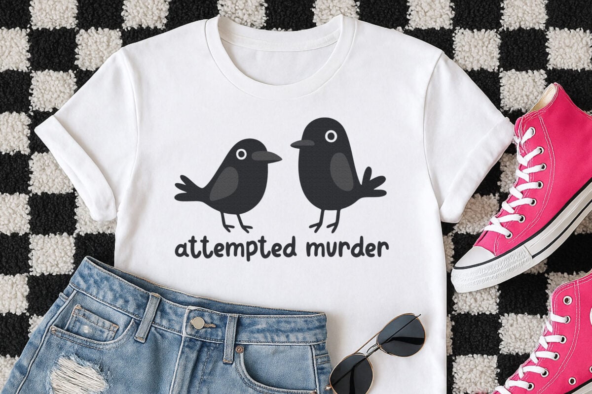 Crow SVG om a white tee on a checkered rug