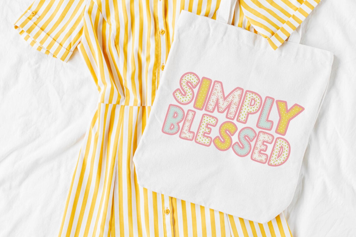 Simply Blessed sublimation file on a white tote with a yellow dress