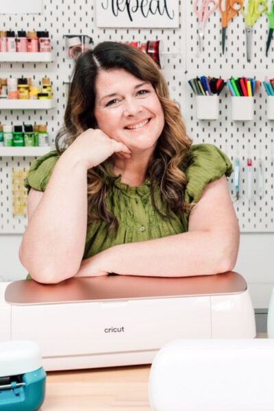 Paula leaning on a Cricut Maker 4