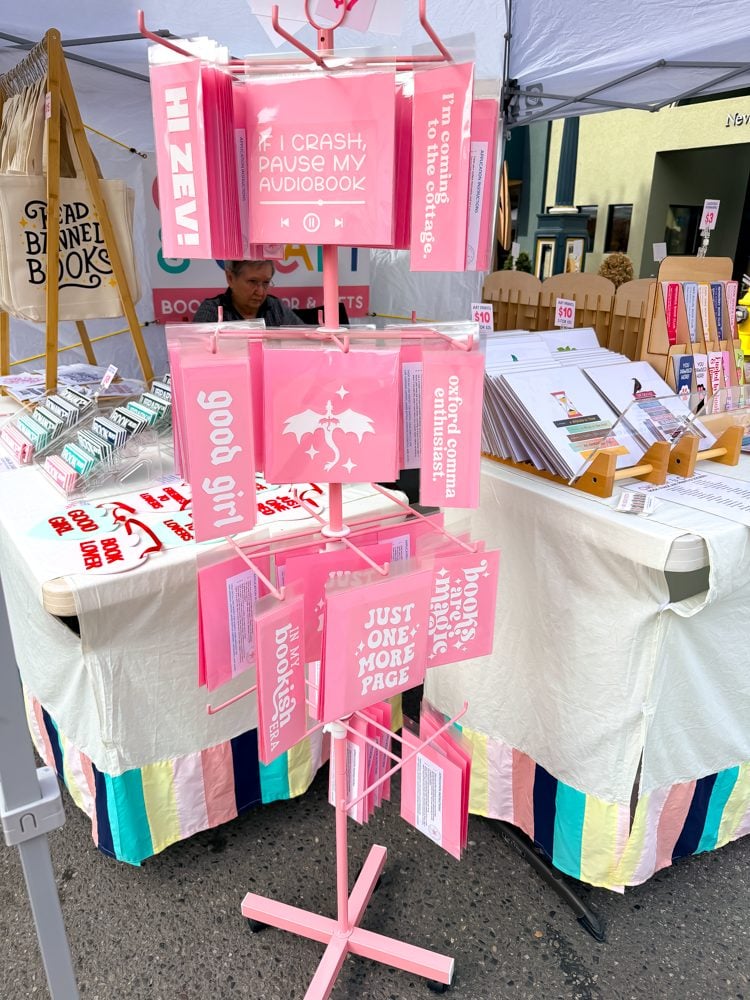 Pink hanging display with bookish car decals