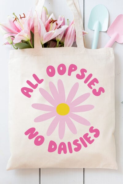 Free Daisy SVG on a tote bag with cute gardening supplies
